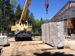 Moving large stone with crane